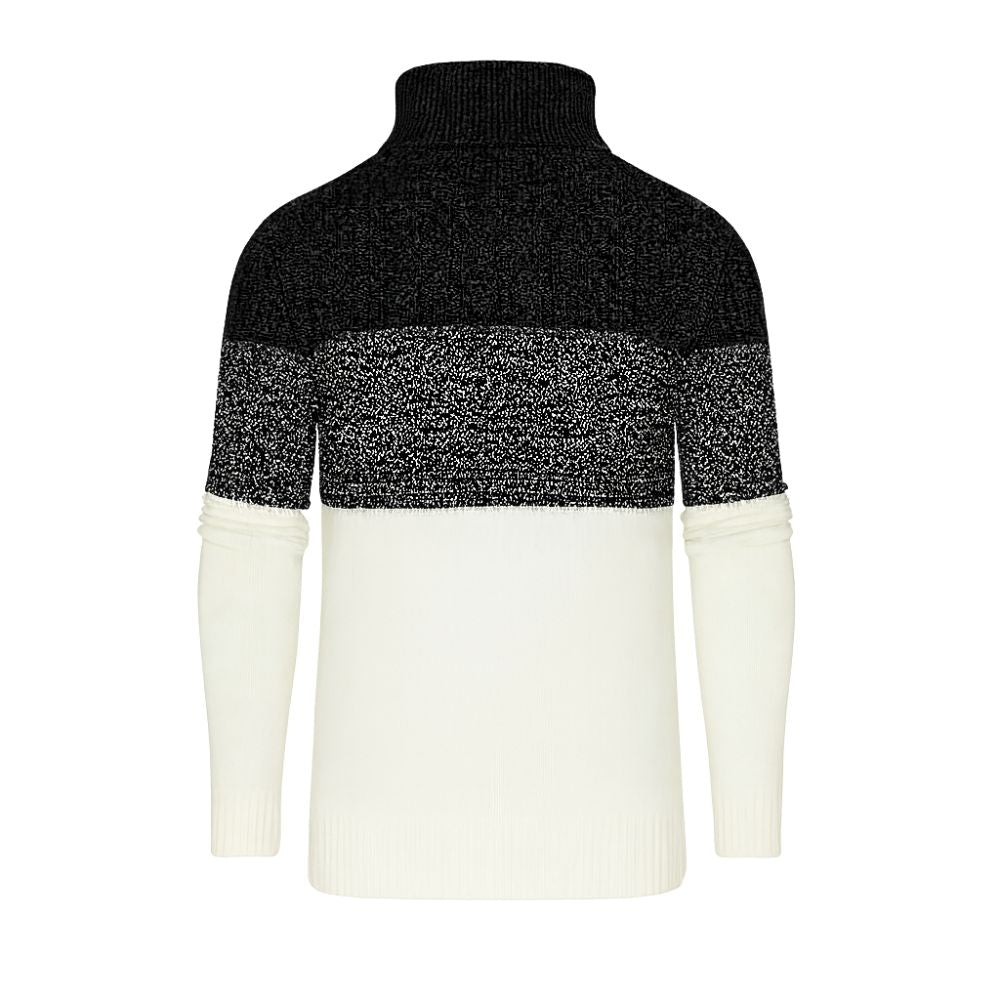 Black and white kouvr sweater with a color-blocked design on a white background