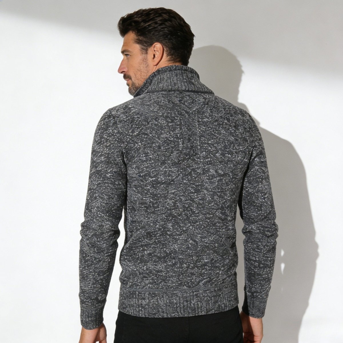 Back view of the Kouvr men's grey elyson knit sweater, displaying the seamless construction and rich texture.