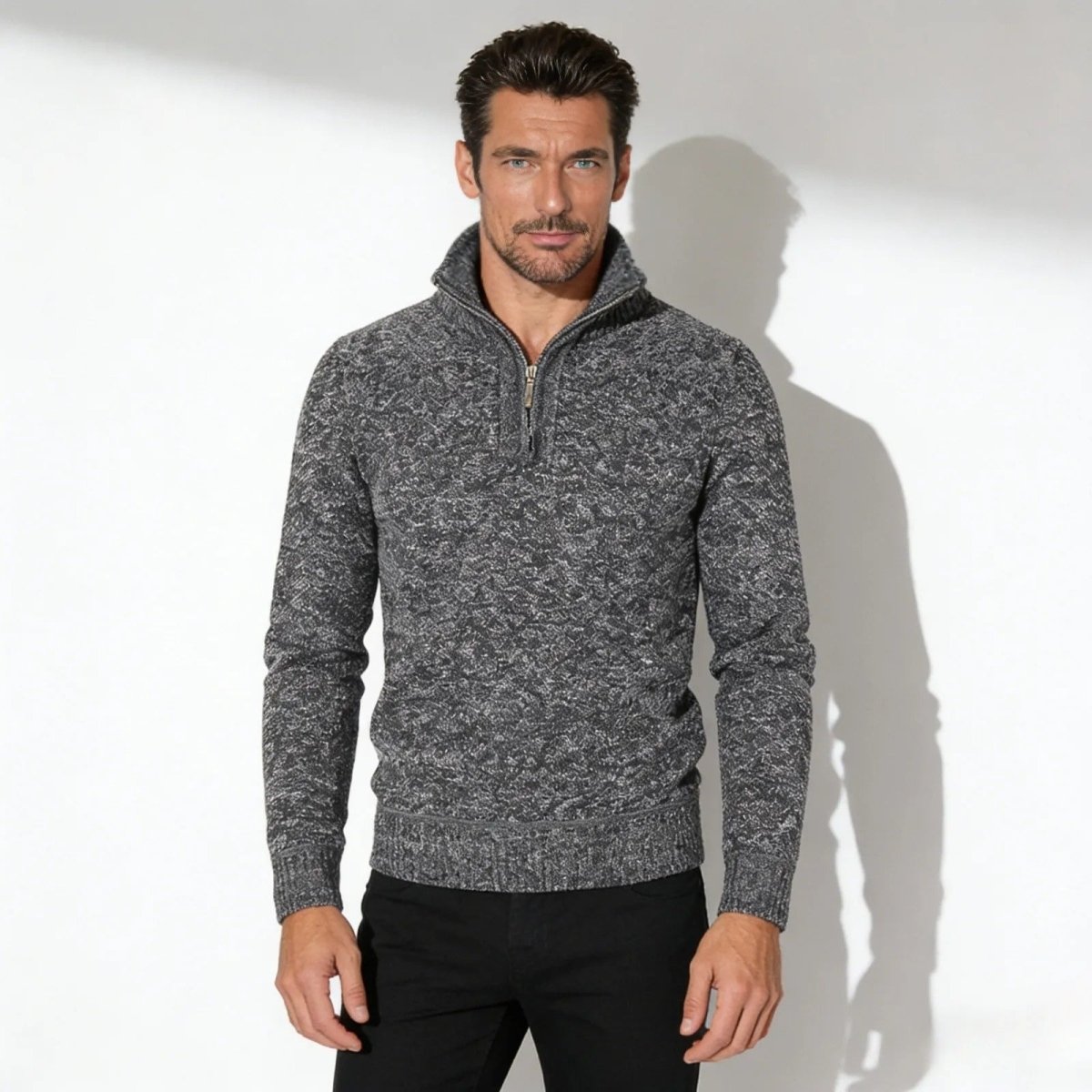 Male model wearing the Kouvr grey elyson knit quarter-zip sweater, showing the textured fabric and fit from the front.