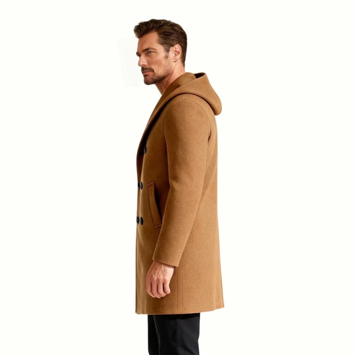 Side profile of a man in the Kouvr khaki wool hooded overcoat, showcasing the fit and the structure of the hood.