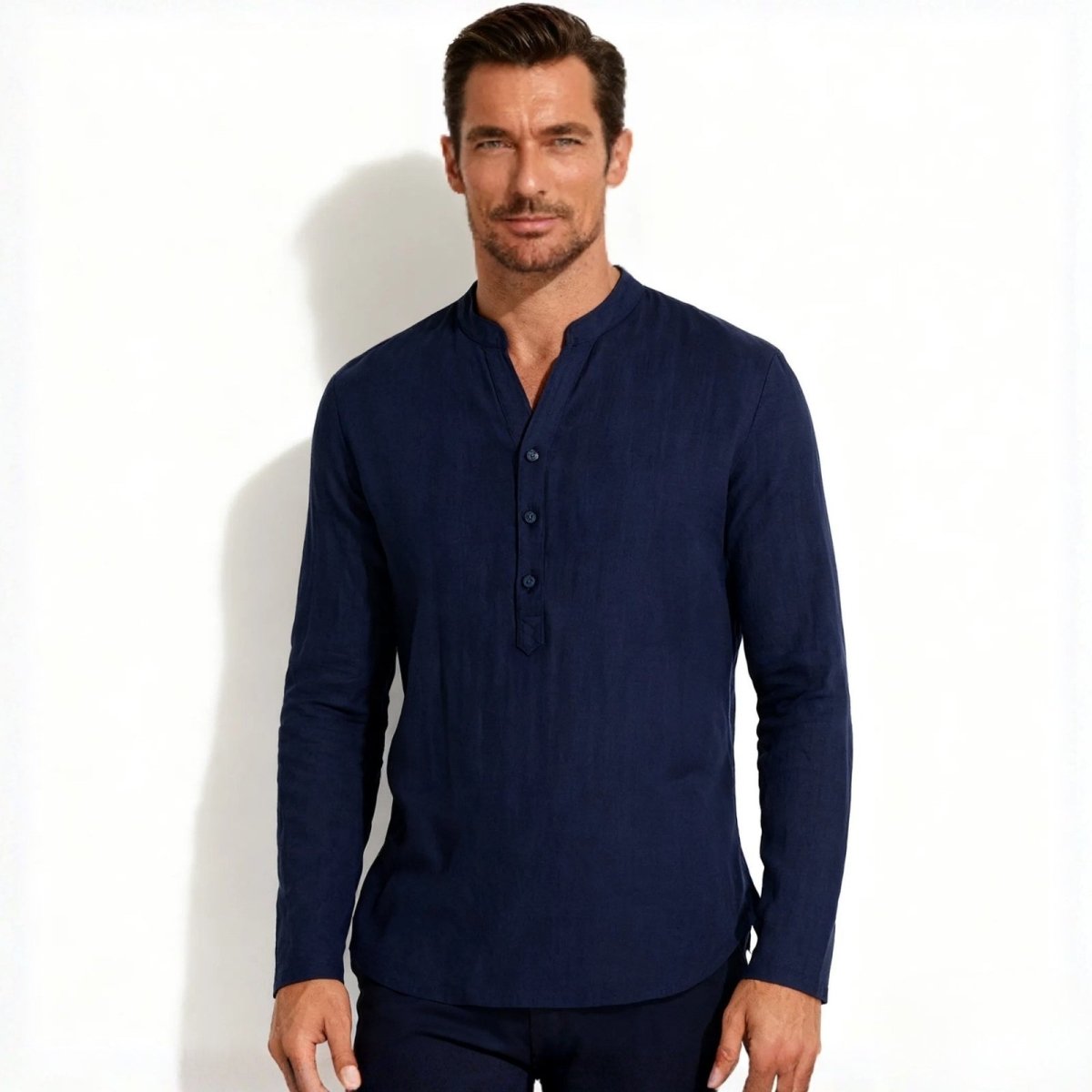Man wearing the Kouvr men's navy blue long-sleeve grandad collar roby shirt, facing forward against a white background.