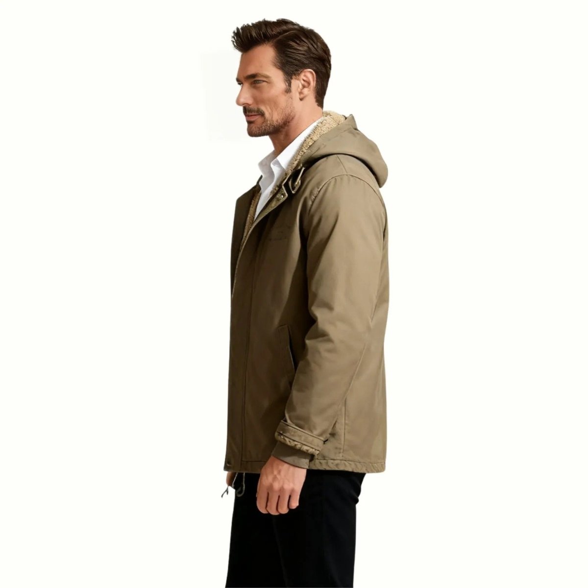 Side profile of a man wearing the Kouvr khaki drab winter field jacket, showcasing its tailored fit and sherpa-lined hood.