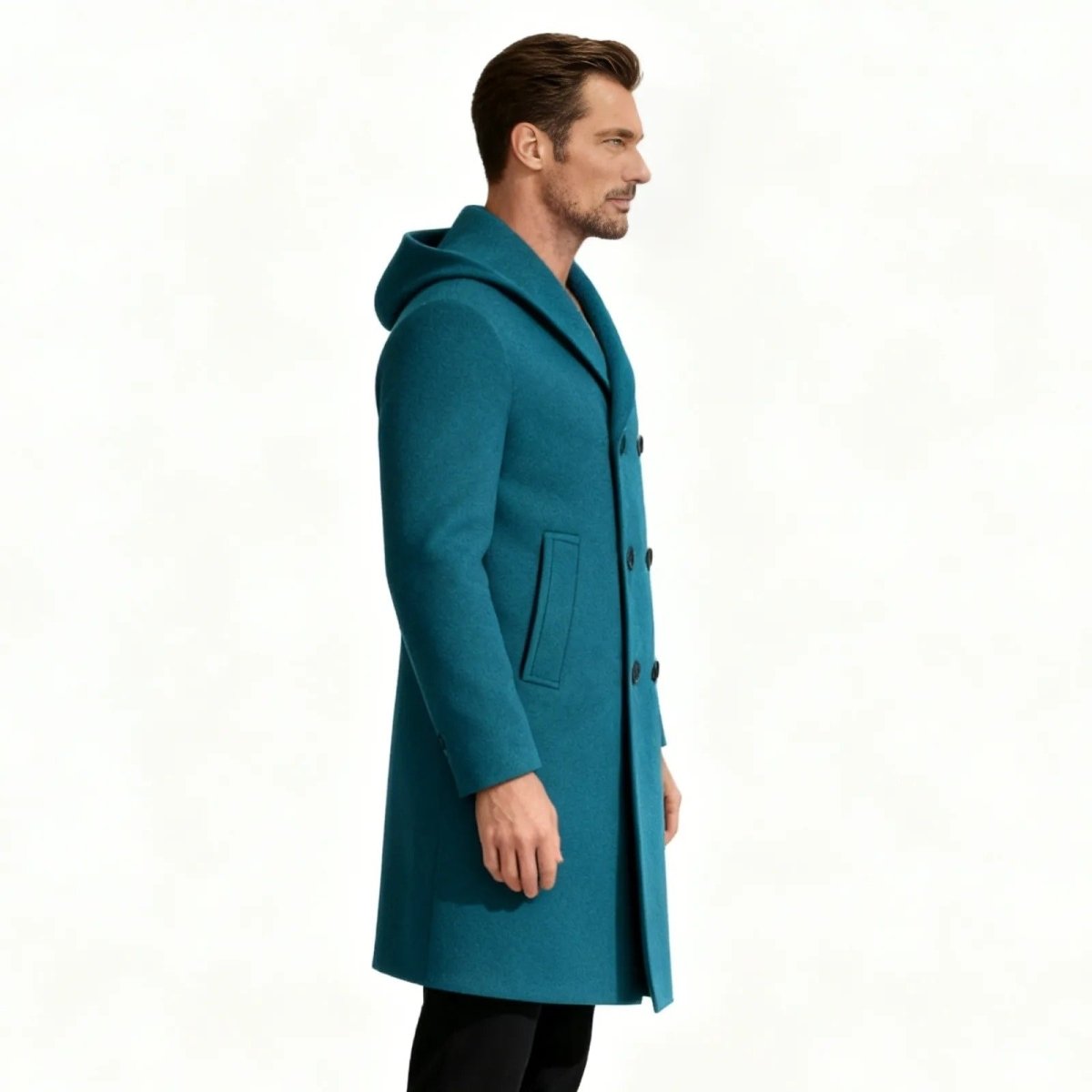 Side profile view of a man in the Kouvr Blue Hooded Overcoat, highlighting the slim fit and deep welt pocket.