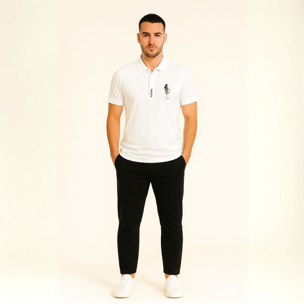 Model wearing the Kouvr white slim fit polo shirt with black trousers.
