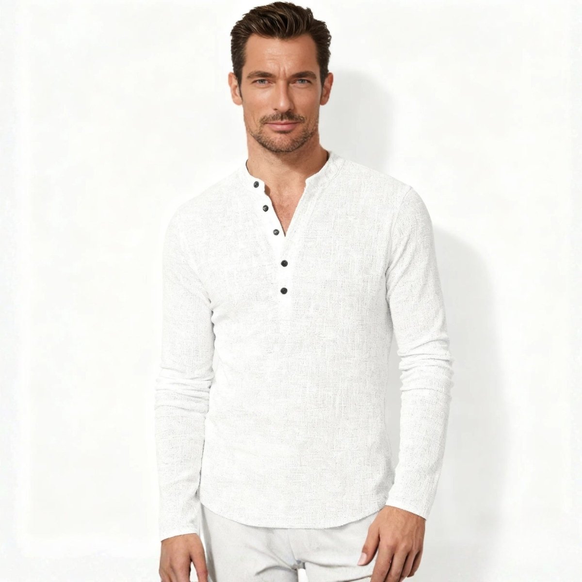 Man with dark hair wearing the Kouvr men's white long-sleeve slub roby shirt with mandarin collar, facing forward against a white background.