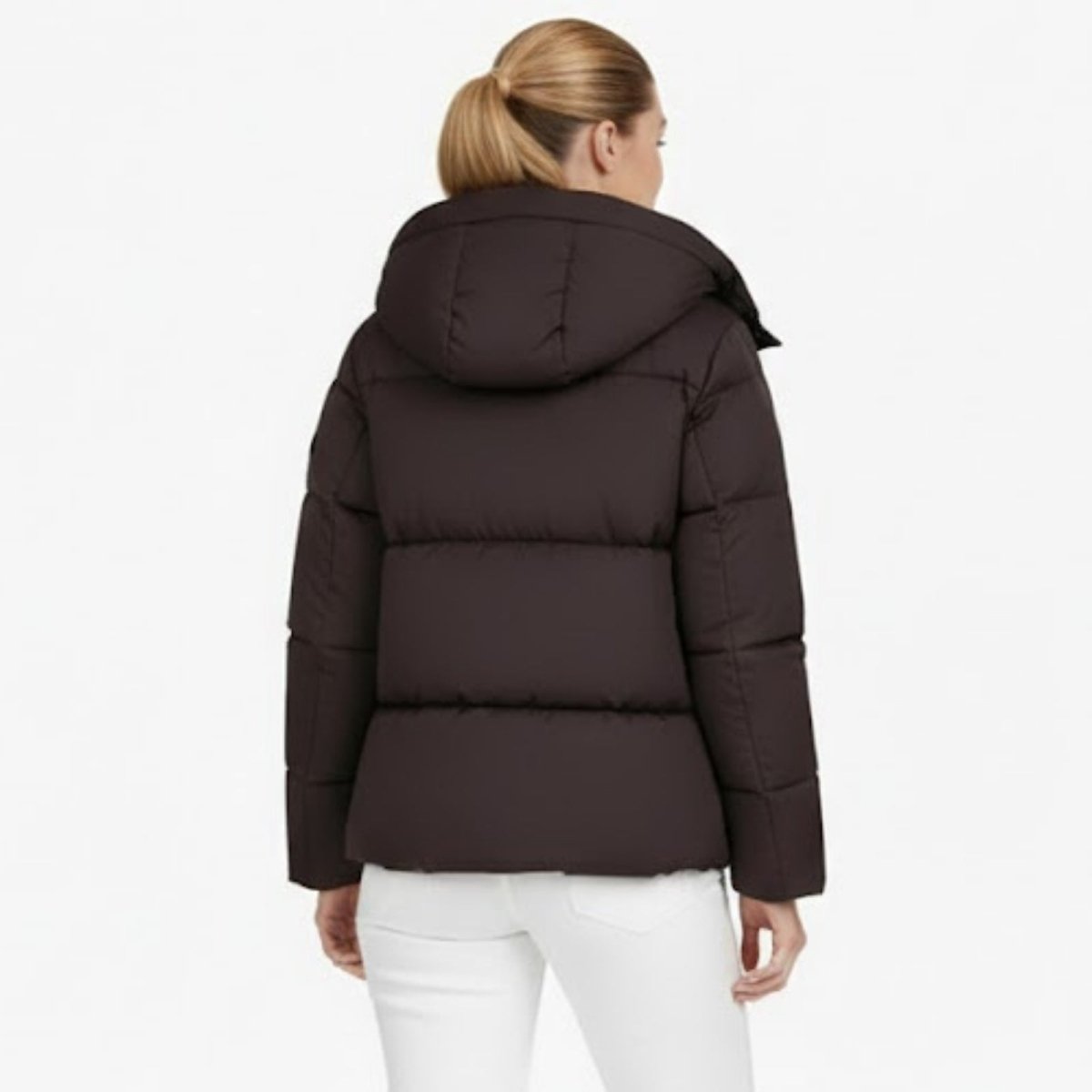 Back view of a woman wearing the Kouvr Miranda puffer jacket in espresso brown, showing the horizontal quilt lines.