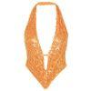 Model wearing Kouvr's Rosette featuring an orange sequin backless halter top