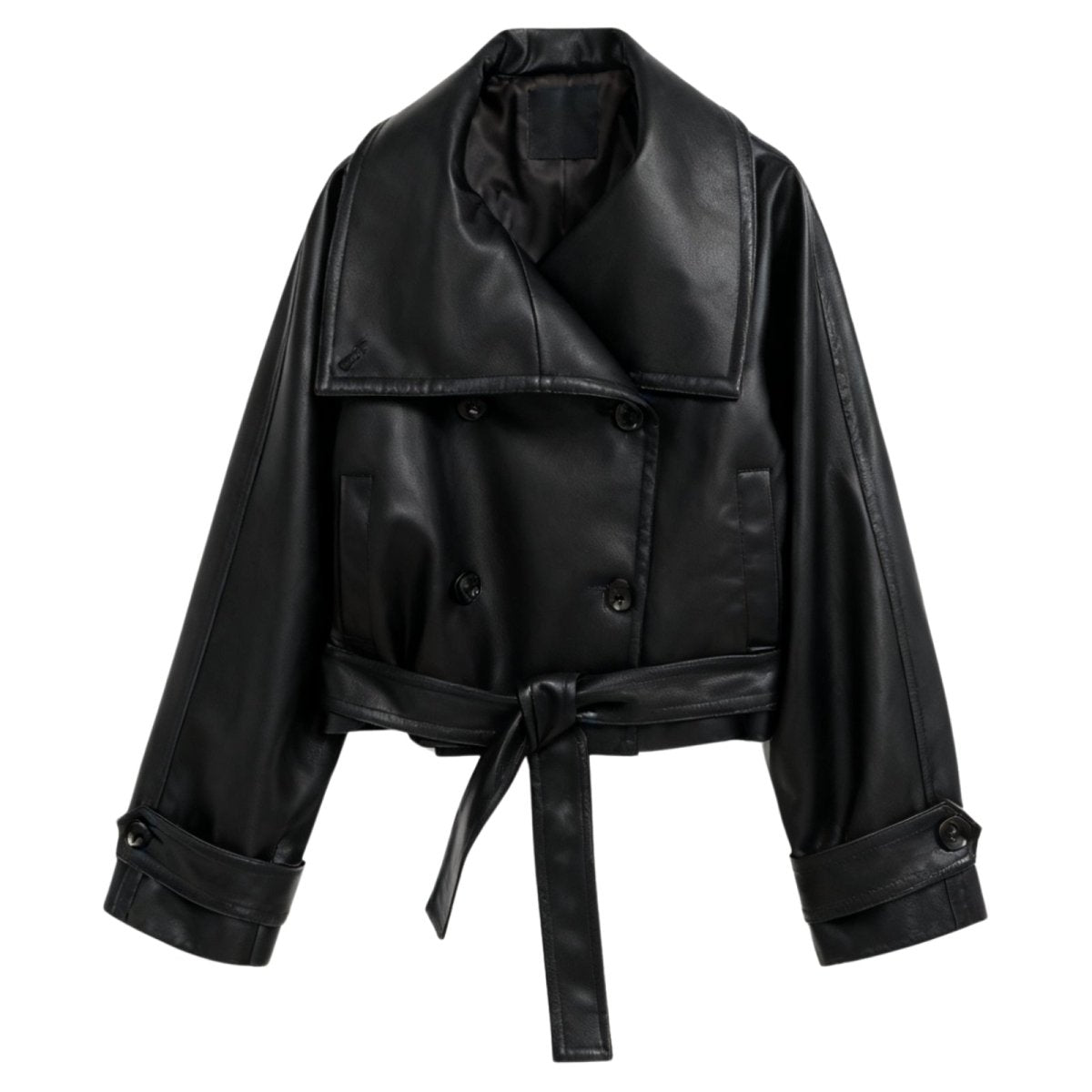 Model wearing the Kouvr Patricia women's cropped black faux leather trench jacket with a tie belt