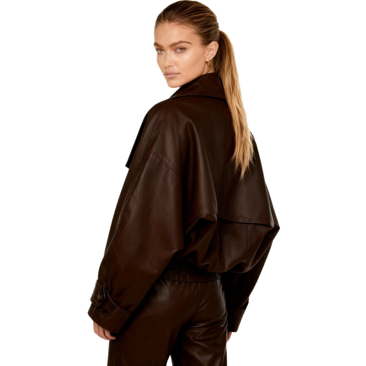 Model wearing Kouvr's Dark Brown cropped faux leather trench jacket with belted waist