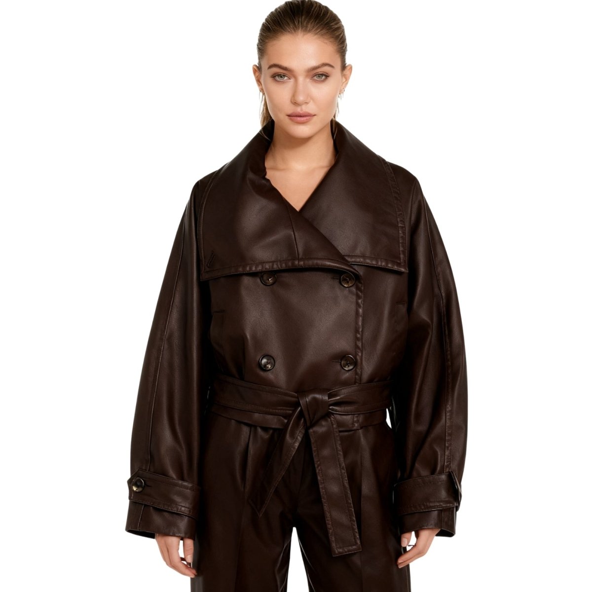 Model wearing Kouvr's Dark Brown cropped faux leather trench jacket with belted waist
