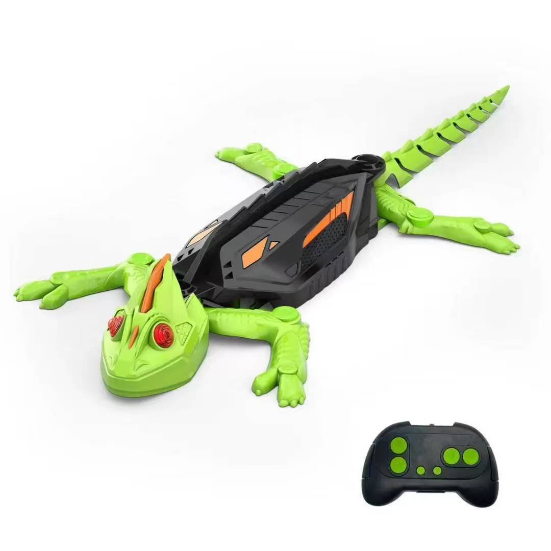 A green and black remote-controlled wall-climbing chameleon toy by Kouvr, shown on a white background with its black and green controller.