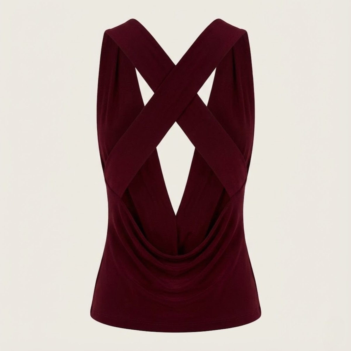 Flat lay product shot of the back of the Kouvr Rhea top in burgundy, emphasizing the criss-cross straps and backless design.