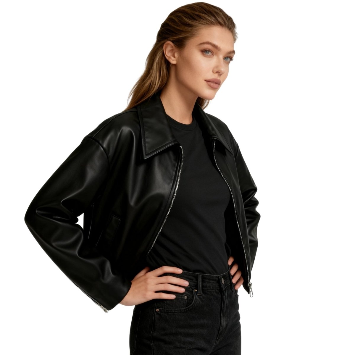 Woman wearing a black Kouvr leather jacket over a black shirt on a white background