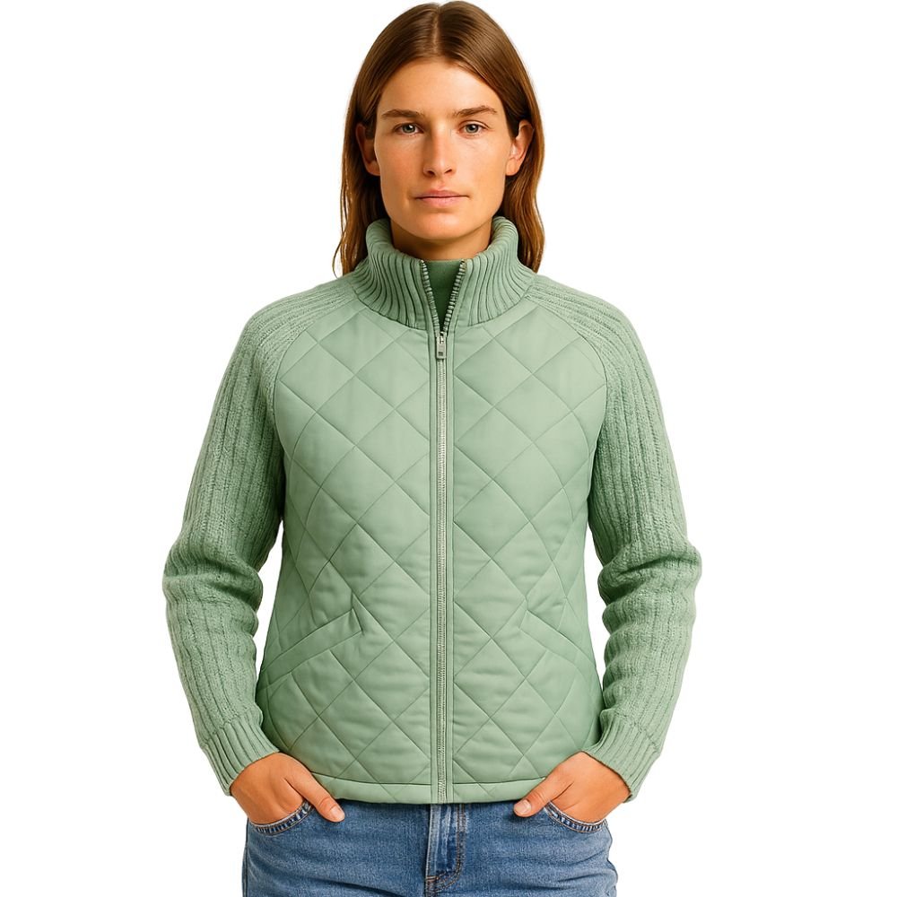 Model wearing Kouvr sage green quilted jacket with cable knit sleeves, viewed from the front