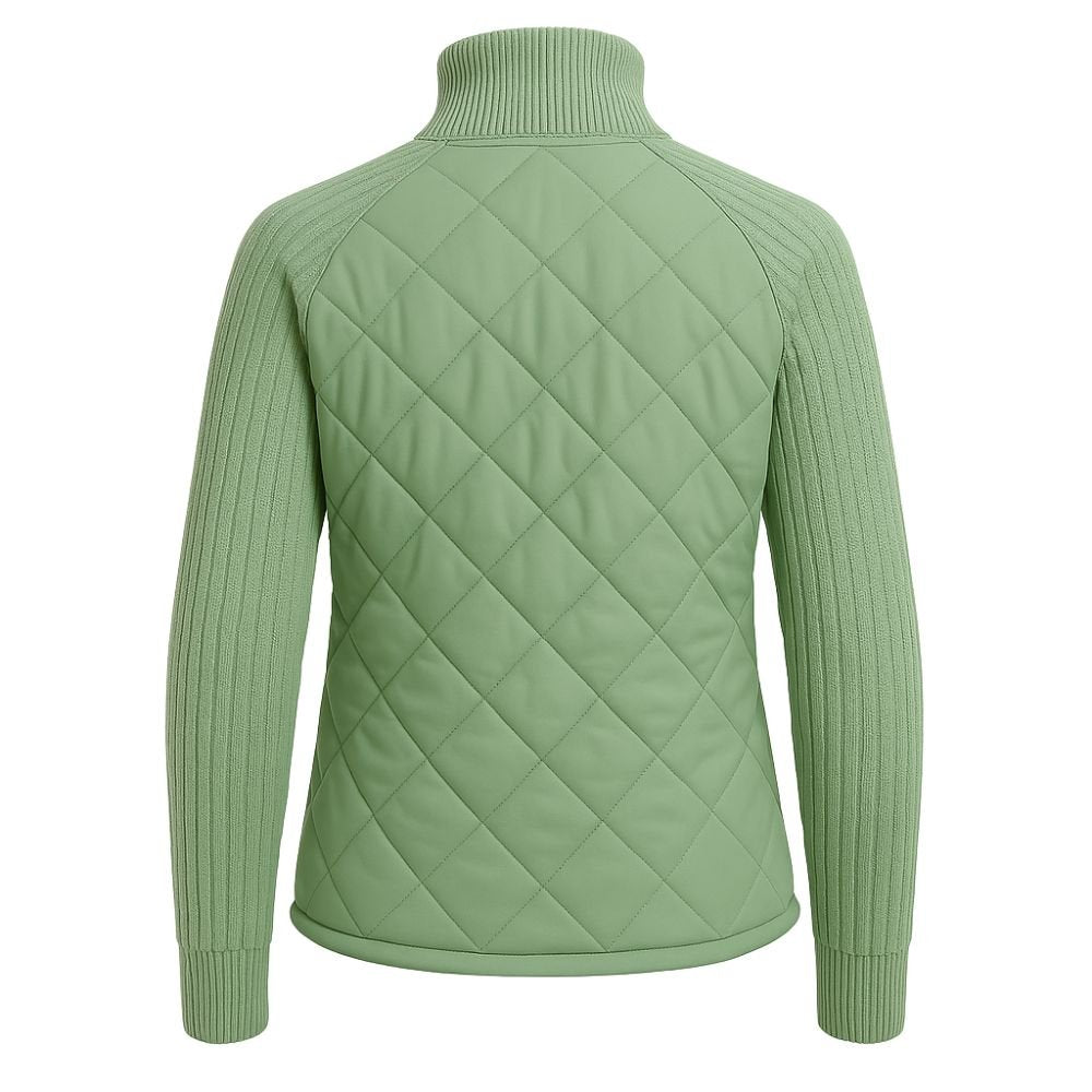 Model wearing Kouvr sage green quilted jacket with cable knit sleeves, viewed from the front