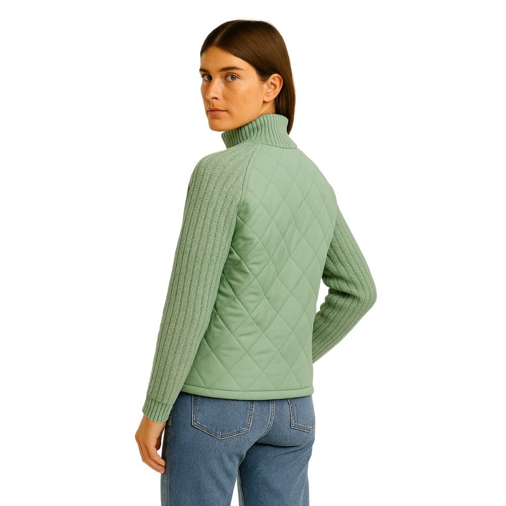 Model wearing Kouvr sage green quilted jacket with cable knit sleeves, viewed from the front