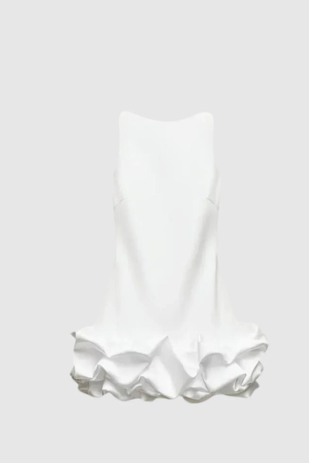 Model wearing Kouvr Fashion's white sleeveless bubble hem mini dress