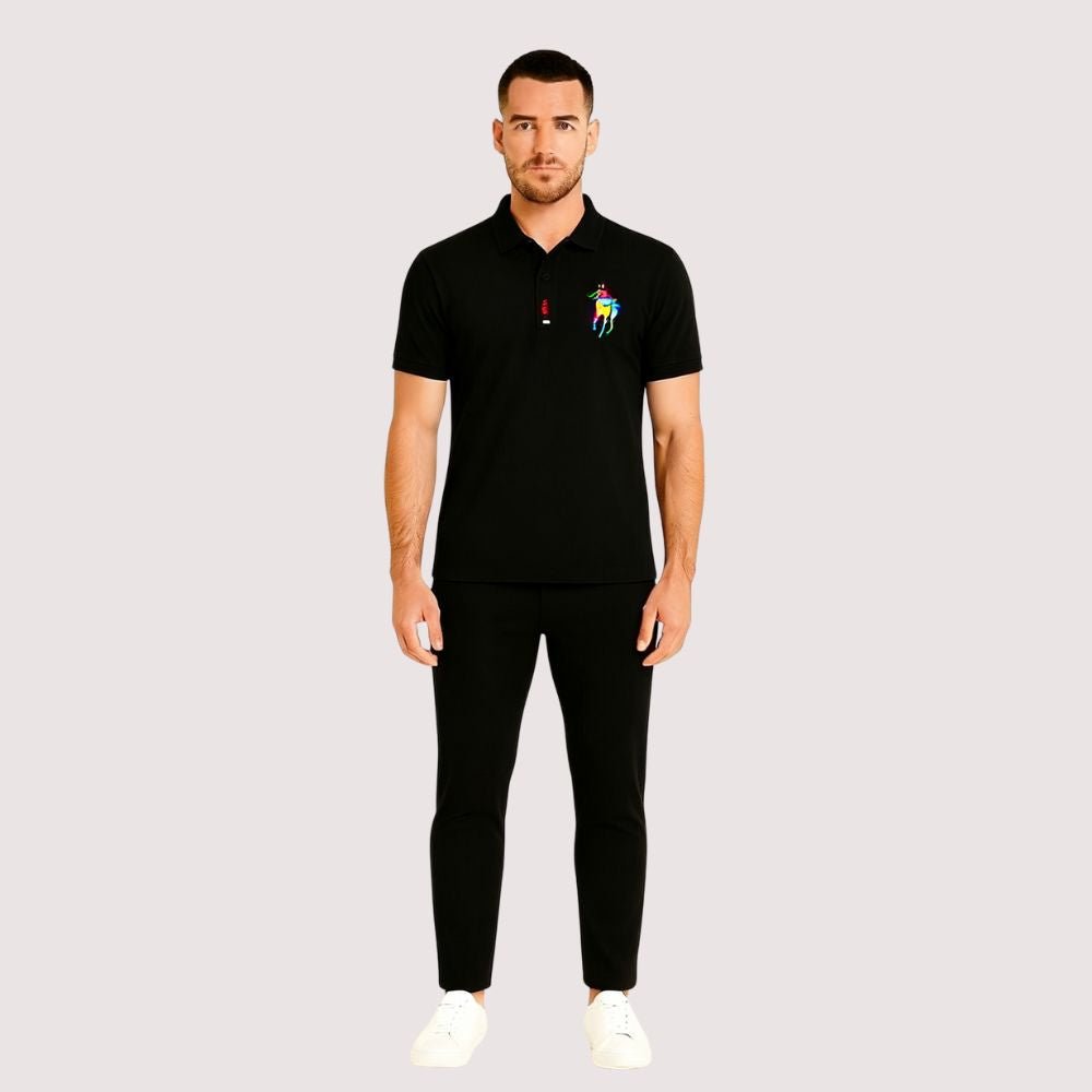 Man wearing the Kouvr Signature Black Polo Shirt with black trousers