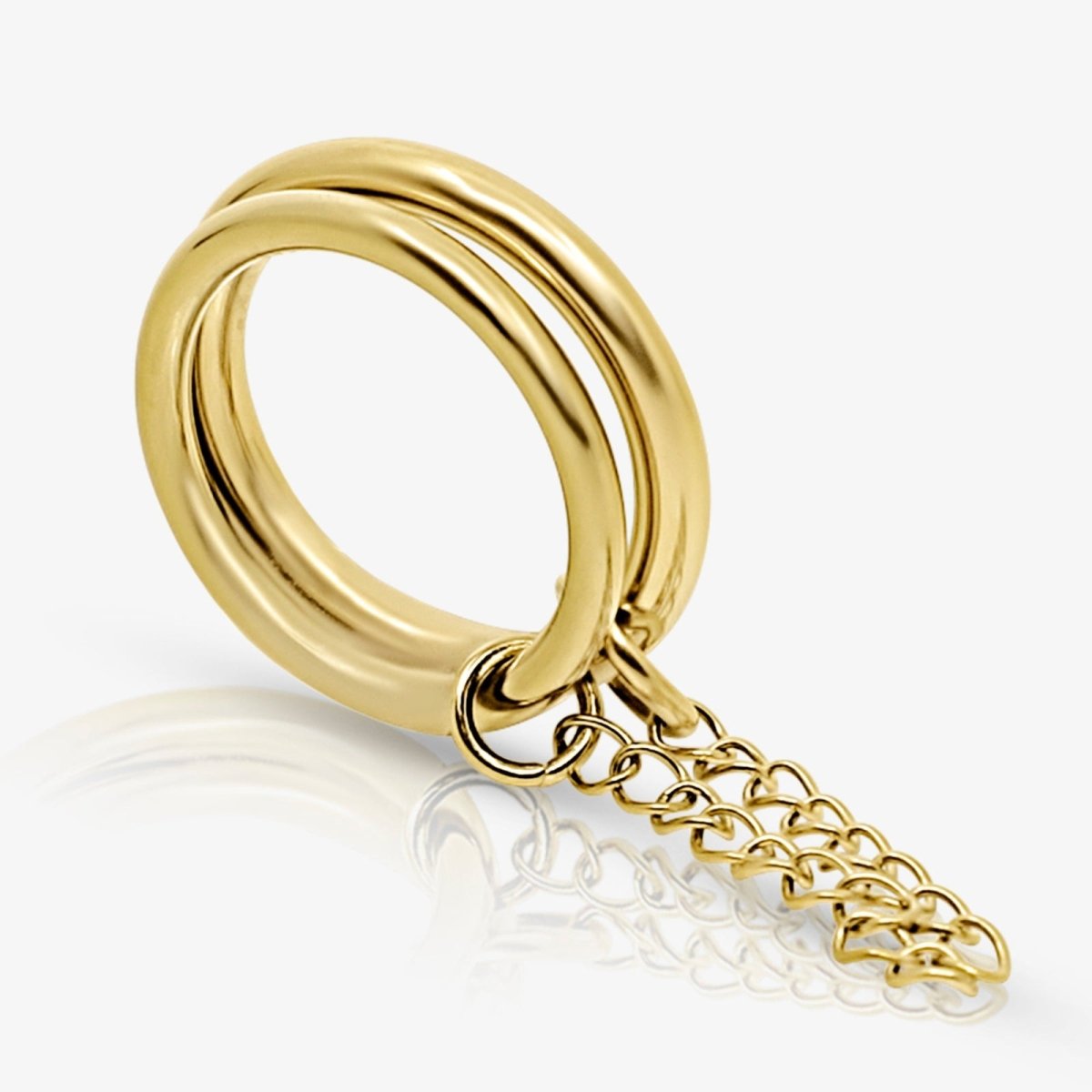 Gold Kouvr ring with a chain on a white background
