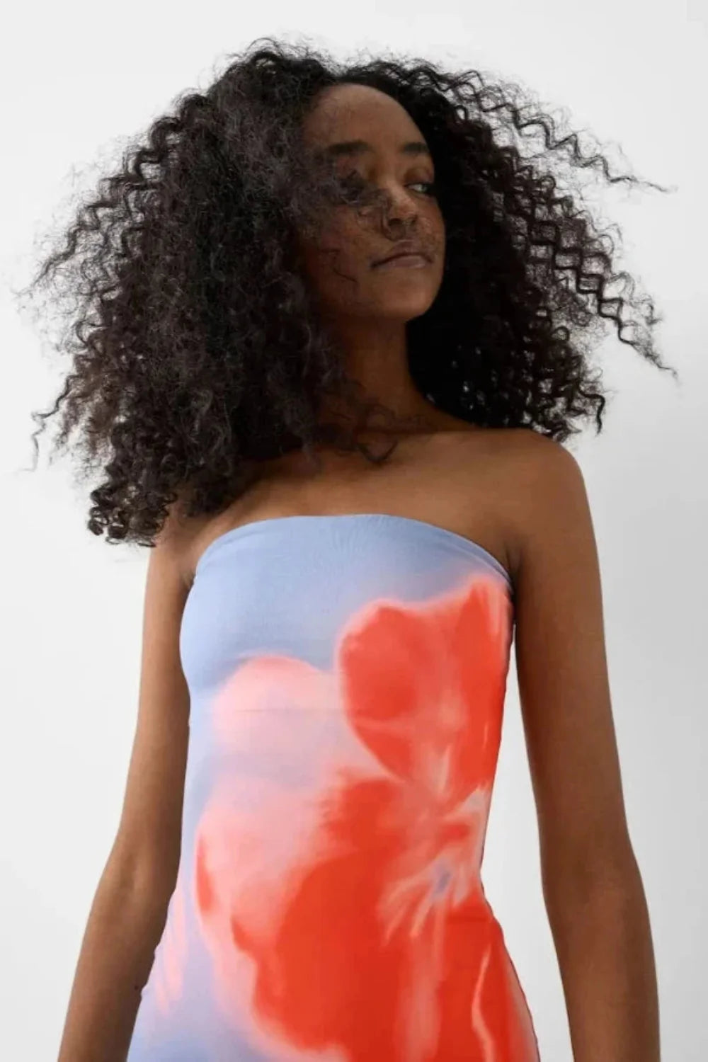 sculpting," "silhouette," "artistic," "vibrant hues," "resort-ready," "evening affair," "statement piece," "stretch-jersey," and "ankle-length