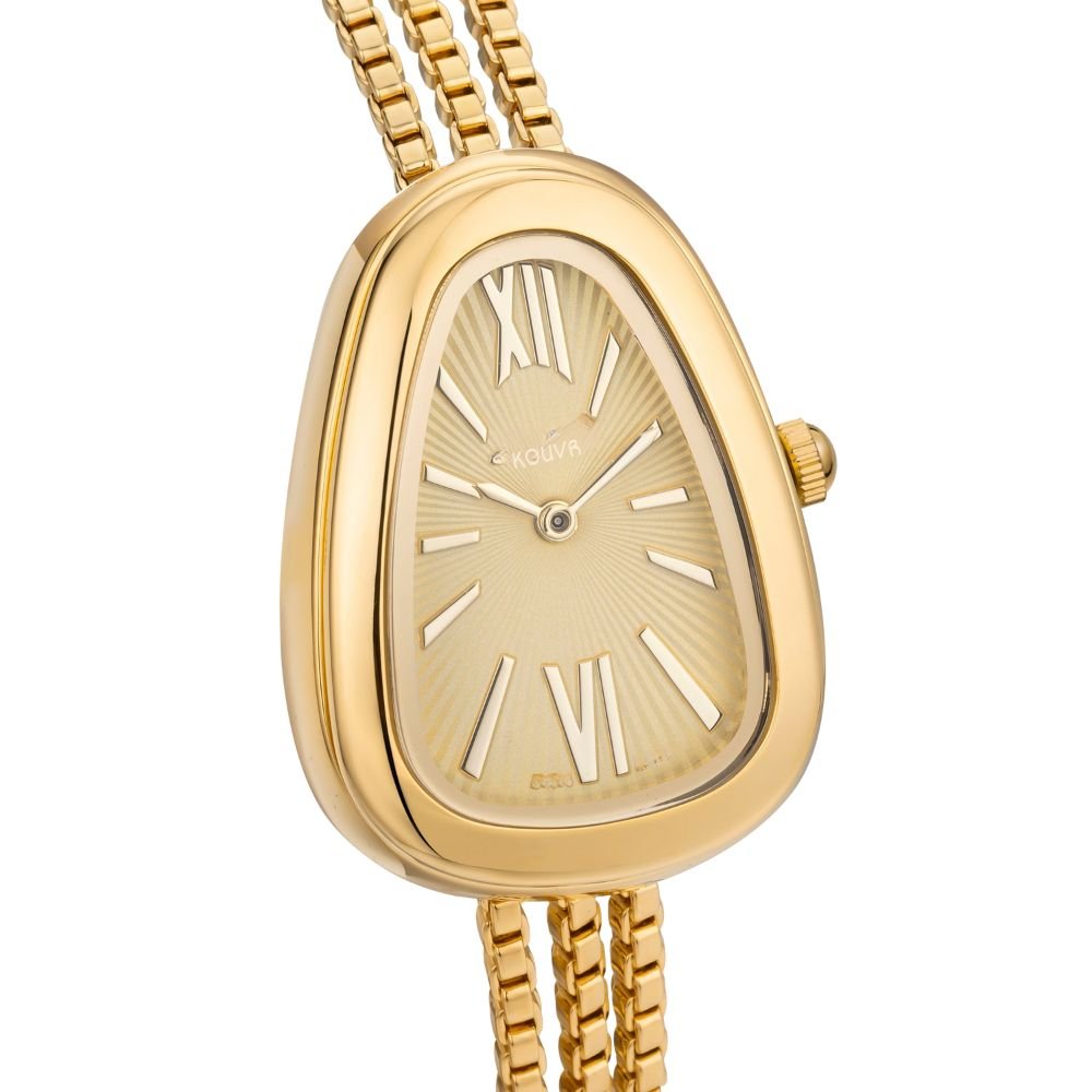Gold kouvr watch with a white face on a white background