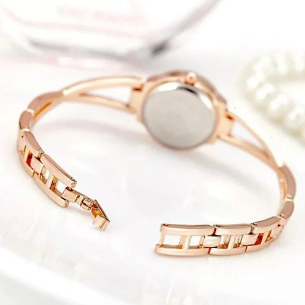 Kouvr SvelteTime women's elegant rose gold bangle watch with crystal accents.