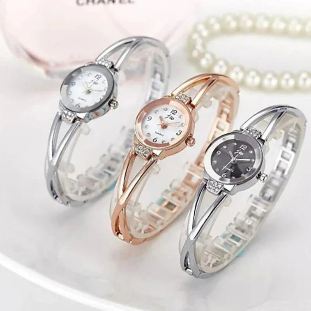 Kouvr SvelteTime women's elegant rose gold bangle watch with crystal accents.