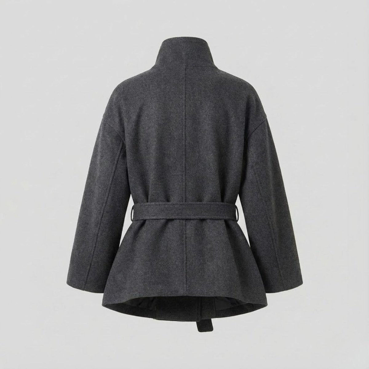 Back flat lay of the Kouvr Verna short wool coat, displaying the construction and belt loop details.