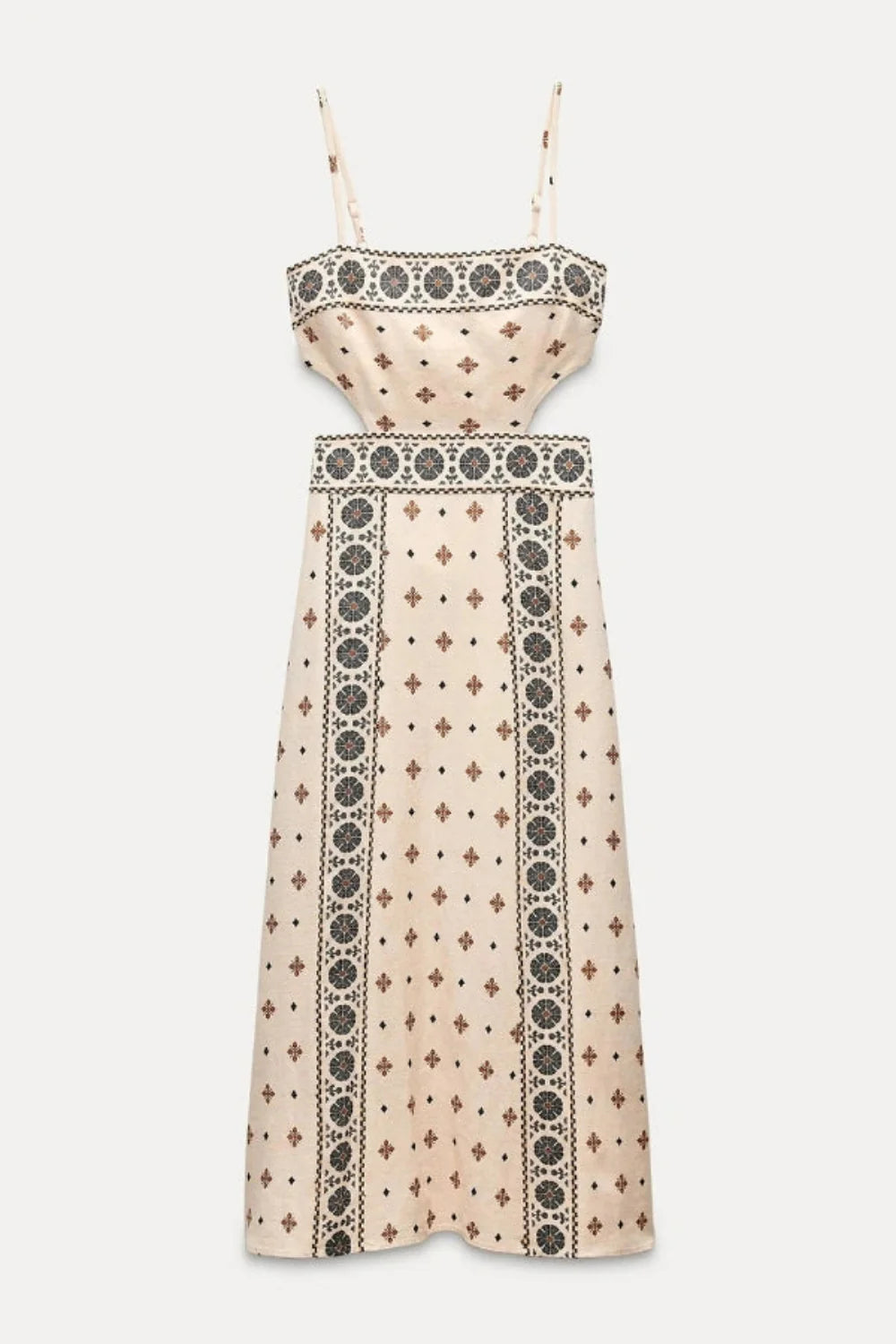 Model wearing Kouvr Vernice embroidered linen cutout midi dress sitting outdoors