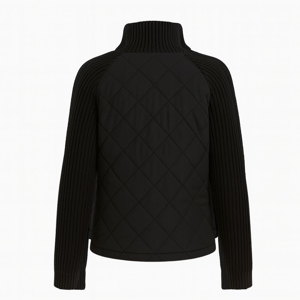 Back view of the black Mika hybrid jacket (flat lay), showing the quilted back and knit sleeves.
