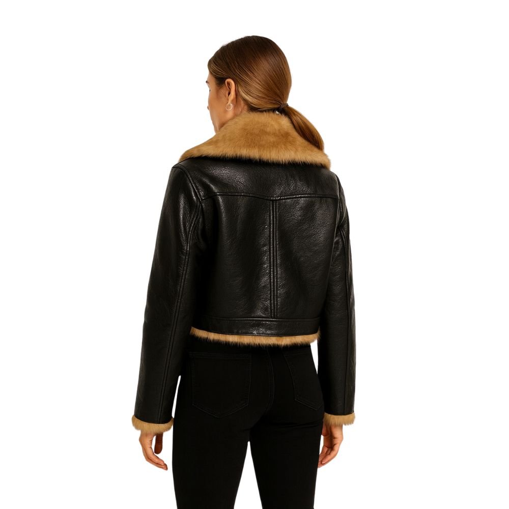 Woman wearing Kouvr Fashion black cropped faux leather aella jacket with brown faux shearling fur collar