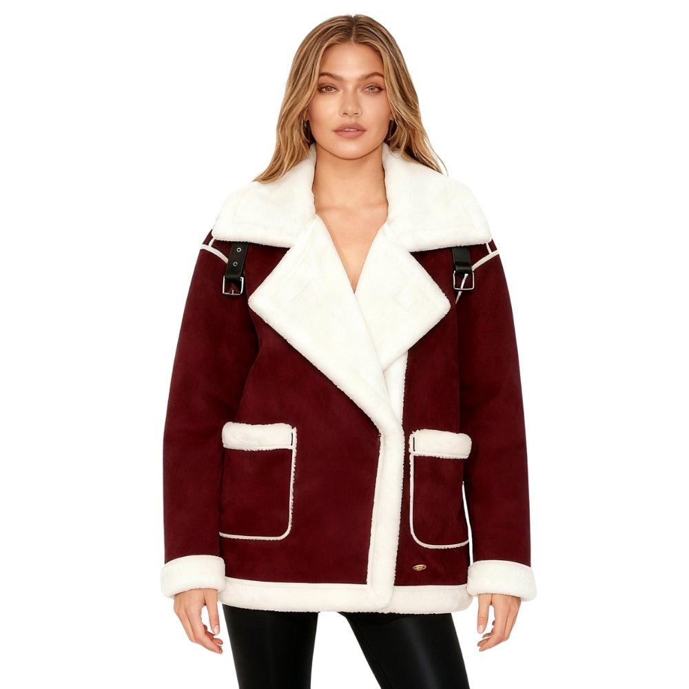 Woman wearing a burgundy Kouvr shearling jacket with white fur trim on a white background
