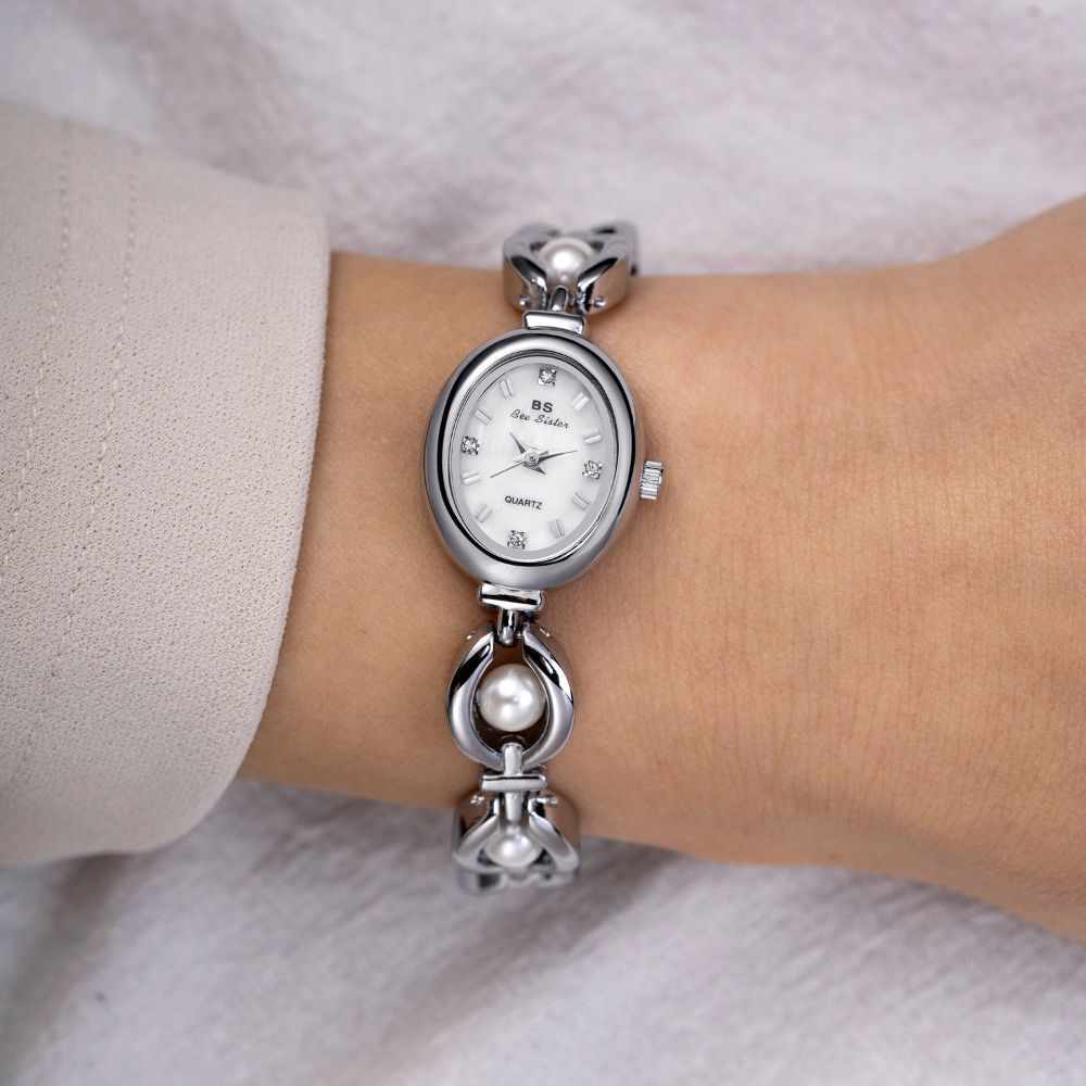 Kouvr Fashion Women's Gold Pearl Bracelet Watch on wrist