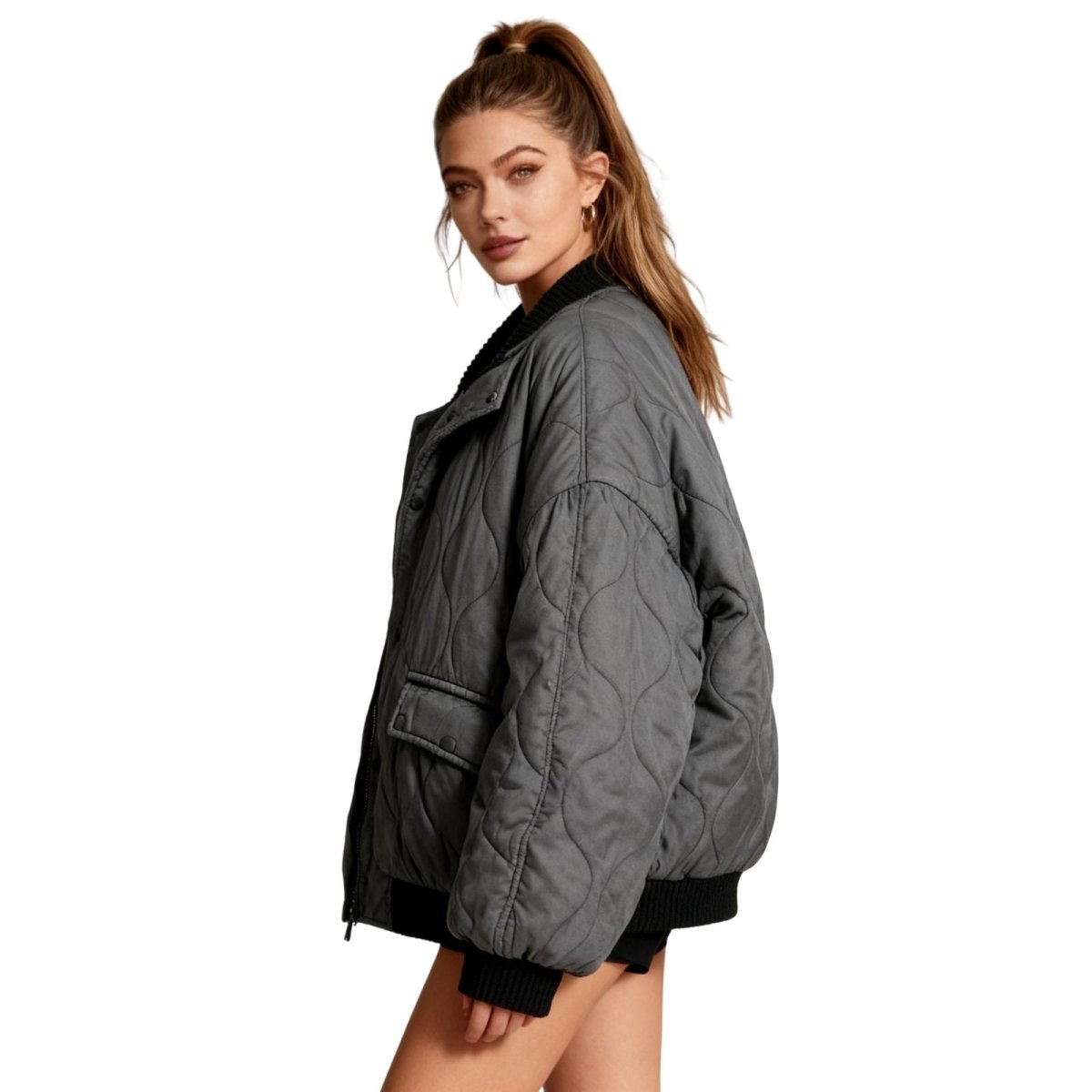 Close up detail of the vintage wash cotton and snap button closure on the Kouvr quilted bomber jacket