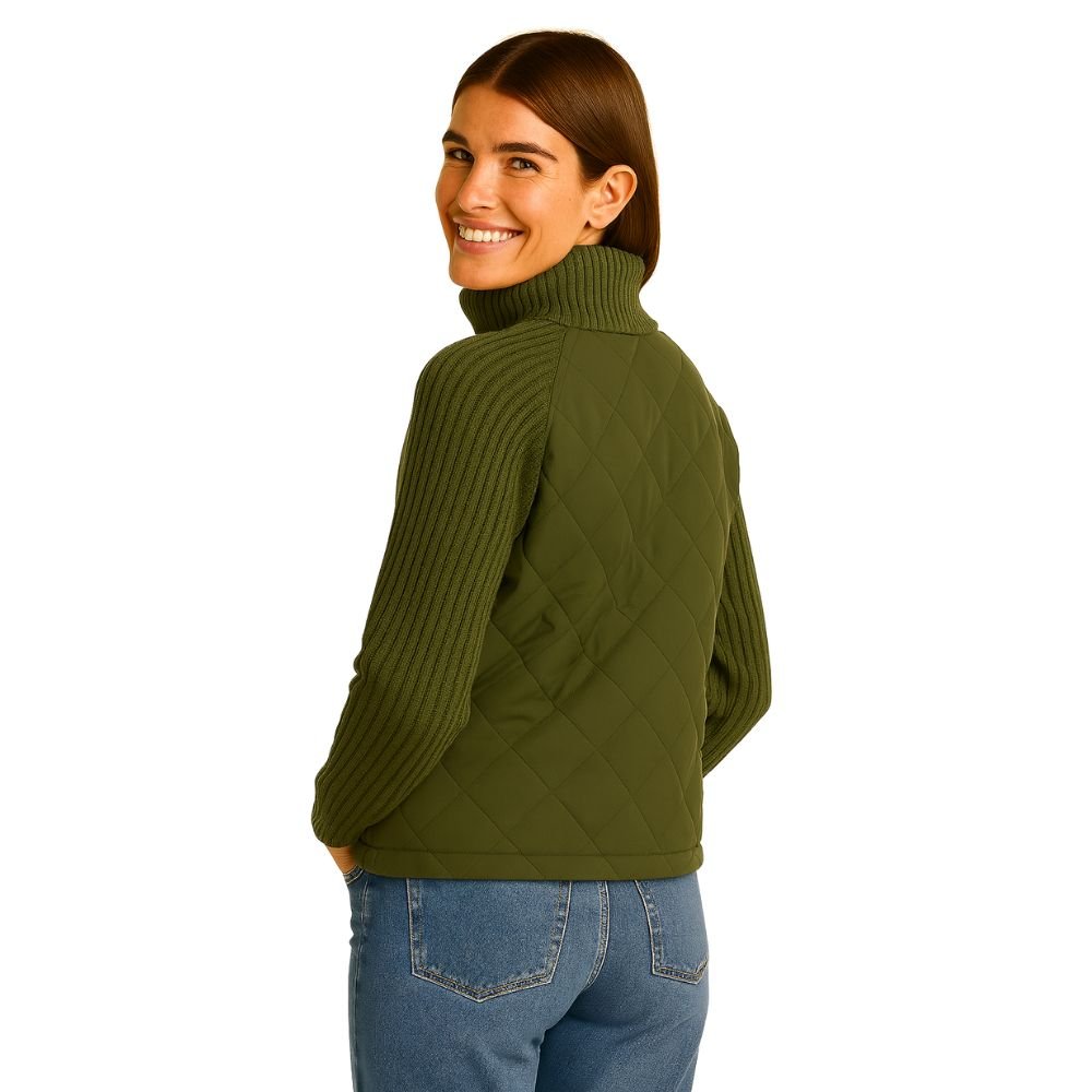 Angled side view of a woman smiling in the Kouvr Mika army green hybrid jacket.
