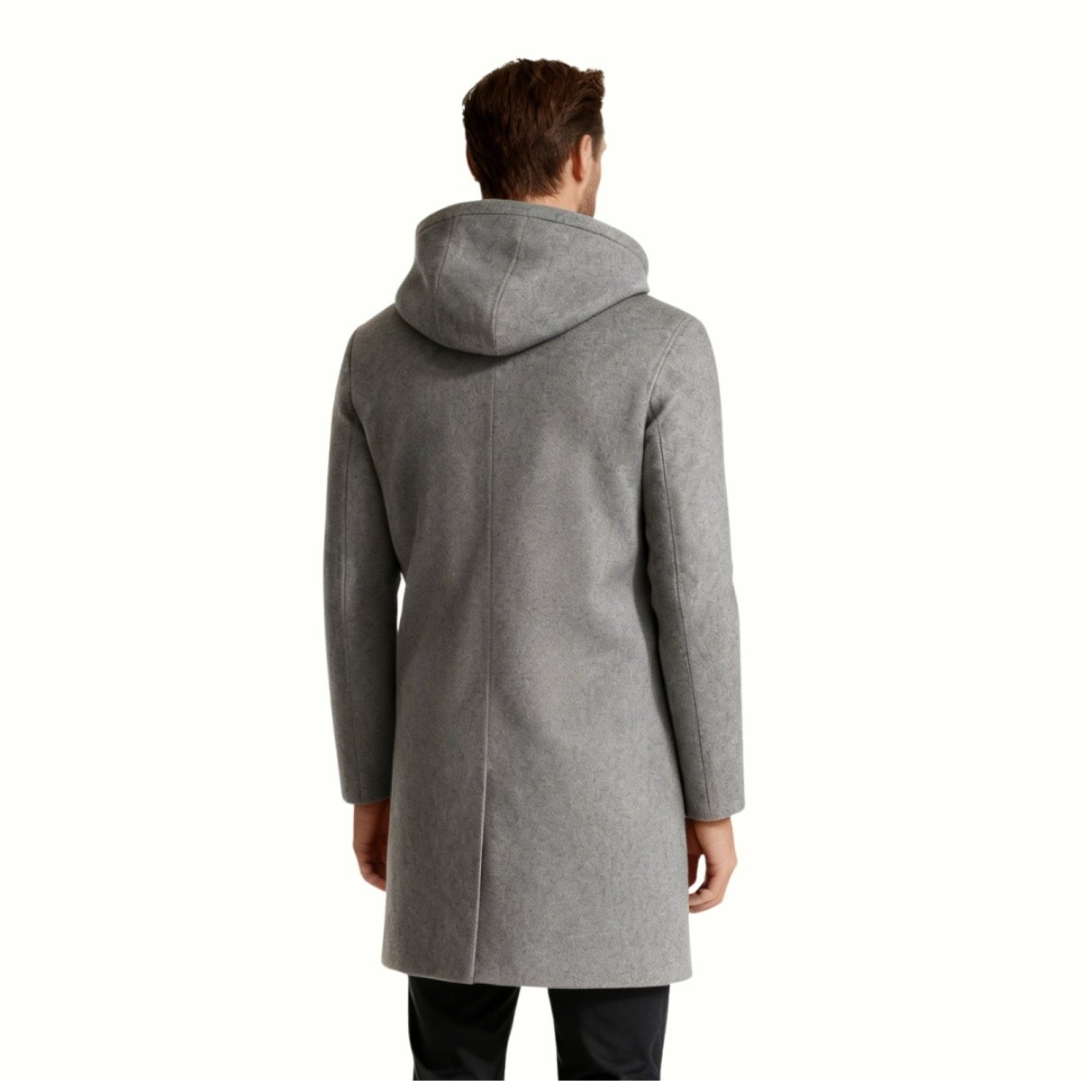 Back profile of a model in the Kouvr Xander men's grey double-breasted winter overcoat, highlighting its mid-length and slim silhouette.